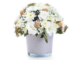 Ofek Flower Arrangement in shades of white, walnuts comes in a in a pink glass vessel