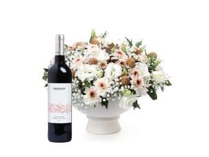 Emanuel Flower Arrangement in shades of white, walnuts. comes with red wine