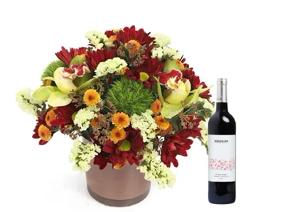 An elegant, blooming, crimson arrangement & red wine