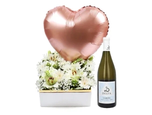 white flowers in a box & white wine