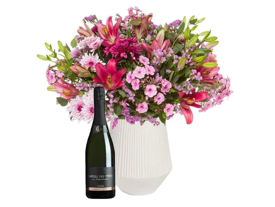 An elegant bouquet with pink festive shades & Cava bottle