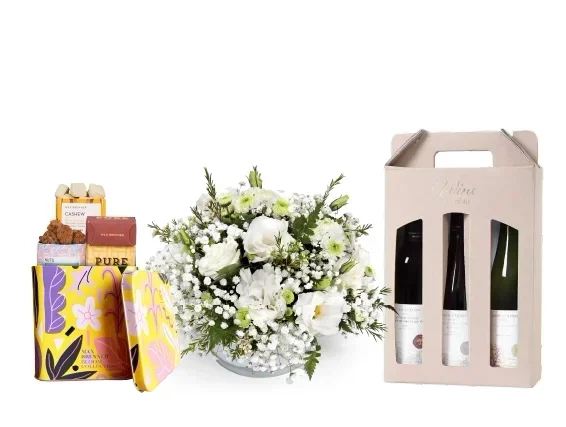 a white flowers, chocolate & 3 wine bottles