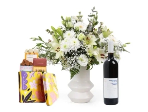 a white flowers, chocolate & red wine bottle