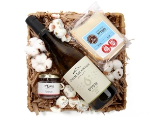 Box with white wine, cheese, and strawberry jam