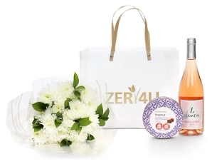 A box with rosé wine, chocolate, and a small bouquet of chrysanthemums.