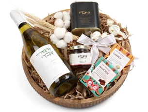 Box with white wine, olive oil, strawberry jam, chocolate