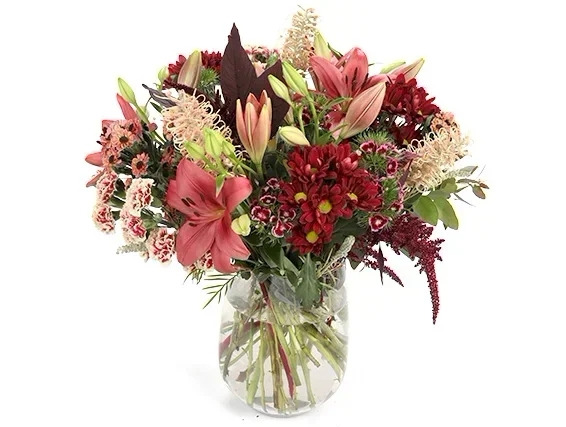 'Abigail' flower bouquet in shades of burgundy, brown, and cream combined with branches for decorati