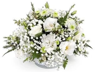 Shea' flower arrangement in shades of white in a white glass vessel