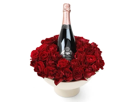 A red roses in ceramics bowl + sparkling wine