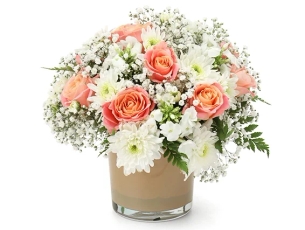 The magic of nature flower arrangement in pure white tones and a touch of peach