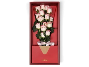 11 lovely pink roses in a luxurious red box