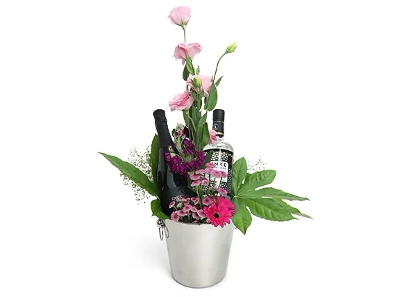 cava bottle, vodka bottle, pink flowers and champagne bucket.