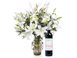 Ornate white holiday bouquet & red wine
