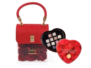 A stylish red rose flower arrangement comes in an elegant bag  & Love chocolate pralines