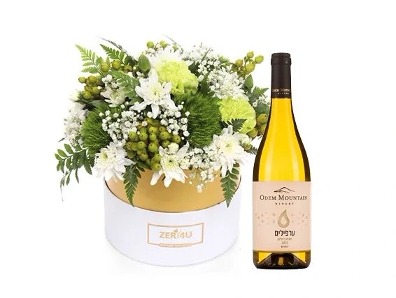White flower arrangement and white wine