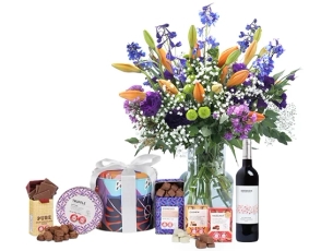 Elian Bouquet in shades of White, Purple and Orange. comes with red wine and chocolates